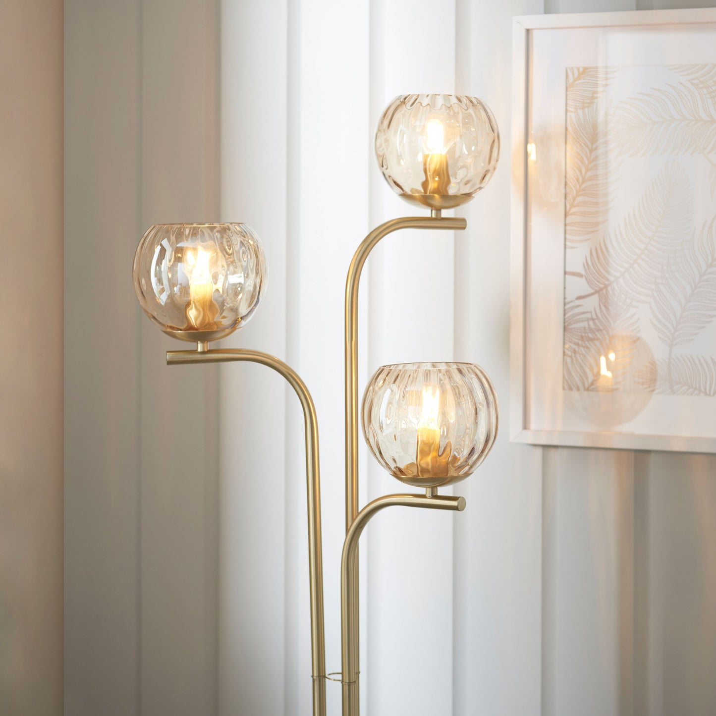 Elegant Brushed Brass Floor Lamp with Triple Globe Glass Shades
