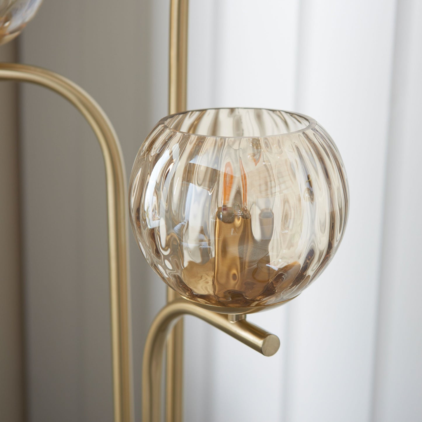 Elegant Brushed Brass Floor Lamp with Triple Globe Glass Shades